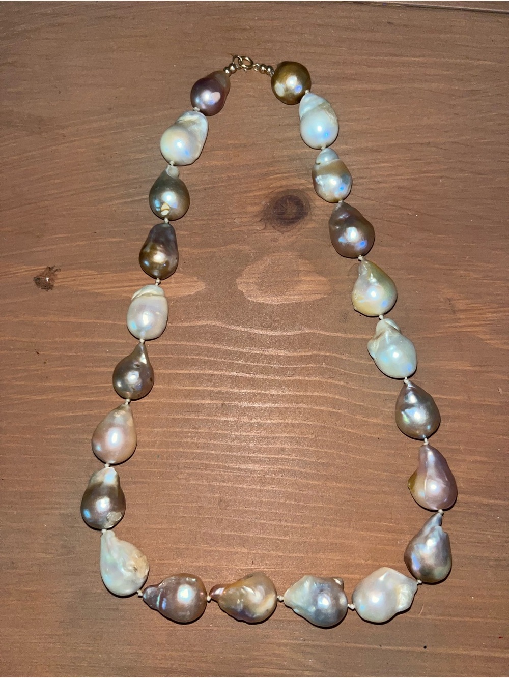 Baroque pearl necklace gold clasp and bead accents. Elegant timeless design.